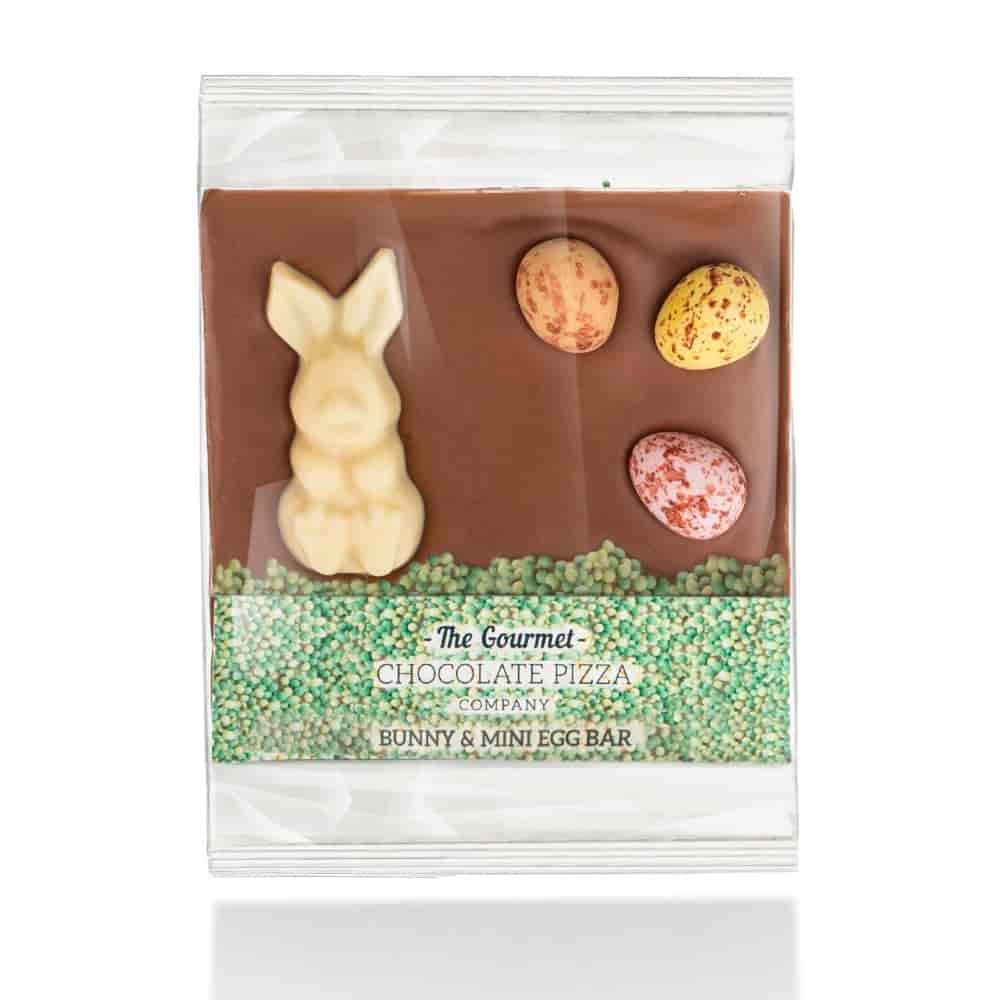 Our popular Bunny Bars are back. This year's design includes a white chocolate bunny, candy covered chocolate mini eggs and green grass sprinkles, sitting on a bar of delicious milk chocolate.